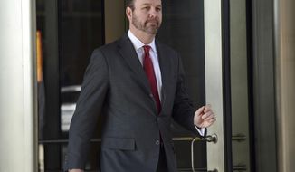 FILE - In this Dec. 11, 2017 file photo, then Deputy Trump campaign aide Rick Gates, departs federal court in Washington. Gates, the former Trump campaign aide and a key cooperator in the special counsel’s Russia probe, is not ready to be sentenced because he continues to help with “several ongoing investigations,” prosecutors said in a court filing Friday. (AP Photo/Susan Walsh)