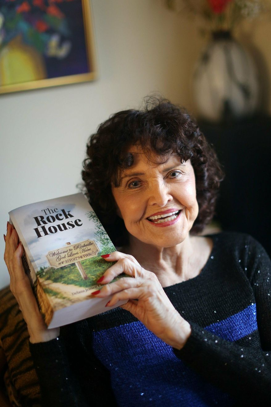 In this Feb. 7, 2019 photo, Delana Close poses with first book in Dublin, Ohio. Delana Jensen Close was recently honored for a book that she finished last year at age 95. In 1955, Delana Jensen Close began to write a book. It's finished now; it just took 63 years.(Courtney Hergesheimer/The Columbus Dispatch via AP)