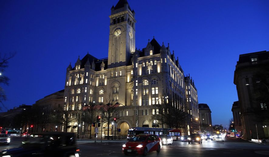 FILE- This Jan. 30, 2018, file photo shows the Trump International Hotel in Washington. A federal appeals court is set to hear arguments in a lawsuit that alleges President Donald Trump is violating the constitution by profiting off the presidency. (AP Photo/Alex Brandon, File)