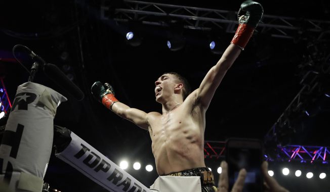 Ireland&#x27;s Michael Conlan gestures to fans after a featherweight boxing match against Mexico&#x27;s Ruben Garcia Hernandez on Sunday, March 17, 2019, in New York. Conlan won the fight. (AP Photo/Frank Franklin II)