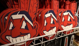 FILE - In this Jan. 29, 2018 file photo, foam images of the MLB baseball Cleveland Indians&#39; mascot Chief Wahoo are displayed for sale at the Indians&#39; team shop in Cleveland. The Chief Wahoo logo is being removed from the Cleveland Indians&#39; uniform in the 2019 season, but the Club will still sell merchandise featuring the mascot in Northeast Ohio. The U.S. has spent most of 2019 coming to grips with blackface and racist imagery, but Native Americans say they don&#39;t see significant pressure applied to those who perpetuate Native American stereotypes. (AP Photo/Tony Dejak, File)