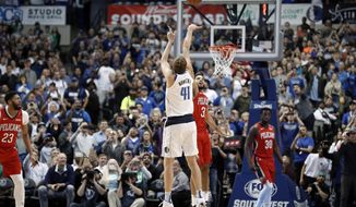 Dallas Mavericks forward Dirk Nowitzki (41) shoots as New Orleans Pelicans’ Kenrich Williams (3) defends and Pelicans’ Julius Randle (30) and Anthony Davis (23) watch in the first half of an NBA basketball game in Dallas, Monday, March 18, 2019. With the basket, Nowitzki became the NBA&#39;s sixth-leading scorer. (AP Photo/Tony Gutierrez)