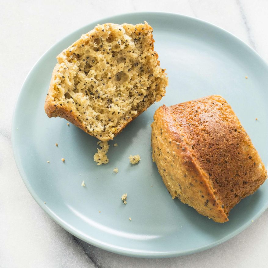 This undated photo provided by America's Test Kitchen in March 2019 shows Anise And Poppy Seed Muffins in Brookline, Mass. This recipe appears in the cookbook "Naturally Sweet." (Carl Tremblay/America's Test Kitchen via AP)