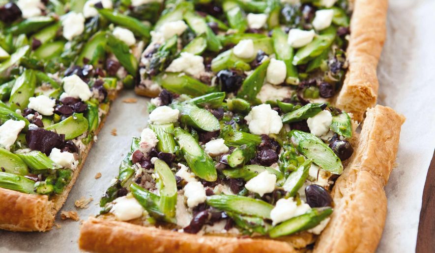 This undated photo provided by America's Test Kitchen in March 2019 shows Asparagus Goat Cheese Tart in Brookline, Mass. This recipe appears in the cookbook "Vegetables Illustrated." (Joe Keller/America's Test Kitchen via AP)