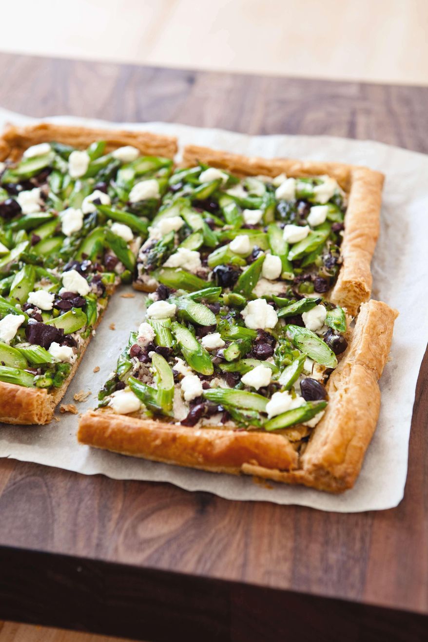 This undated photo provided by America's Test Kitchen in March 2019 shows Asparagus Goat Cheese Tart in Brookline, Mass. This recipe appears in the cookbook "Vegetables Illustrated." (Joe Keller/America's Test Kitchen via AP)