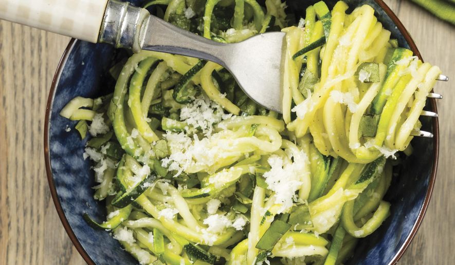 This undated photo provided by America's Test Kitchen in March 2019 shows Roasted Zucchini Noodles in Brookline, Mass. This recipe appears in the cookbook "The Complete Cookbook for Young Chefs." (Daniel J. van Ackere/America's Test Kitchen via AP)
