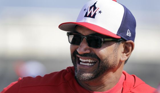 FILE - In this Feb. 16, 2019, file photo, Washington Nationals manager Dave Martinez laughs during spring training baseball practice, in West Palm Beach, Fla. Martinez heads into Year 2 on the job knowing that his team needs to play better, and win more, than it did in his first season. (AP Photo/Jeff Roberson) ** FILE **