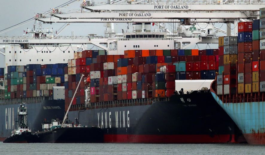 The Yang Ming shipping line container ship Ym Utmost is unloaded at the Port of Oakland on Monday, July 2, 2018, in Oakland, Calif. The Trump administration on Friday, July 6, 2018, will start imposing tariffs on $34 billion in Chinese imports. (AP Photo/Ben Margot)