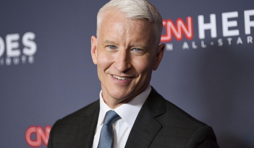 FILE - In this Dec. 9, 2018 file photo, host Anderson Cooper attends the 12th annual CNN Heroes: An All-Star Tribute at the American Museum of Natural History, in New York. Cooper has a 2-book deal and plans for collaborating with historian-novelist Katherine Howe. Harper announced Tuesday, March 19, 2019, that the CNN anchor and "60 Minutes" correspondent will work on two books of nonfiction with Howe, who specializes in novels about witchcraft, including "The Daughters of Temperance Hobbs" and "The Physick Book of Deliverance Dane." (Photo by Evan Agostini/Invision/AP, File)