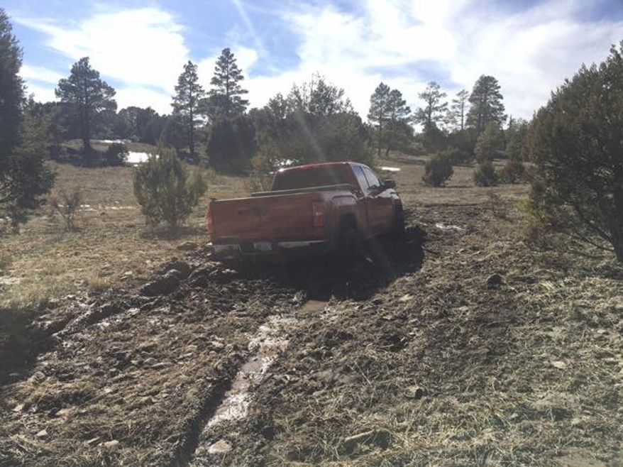 This March 2019 photo provided by the Coconino County Sheriff's Office shows a vehicle belonging to Ryan Long near Happy Jack, Ariz. Long, 38, who likely died from exposure while stranded in Arizona might have survived if he had not rejected rescue efforts because he was afraid of being arrested, authorities said Tuesday, March 19, 2019. (Coconino County Sheriff's Office via AP)