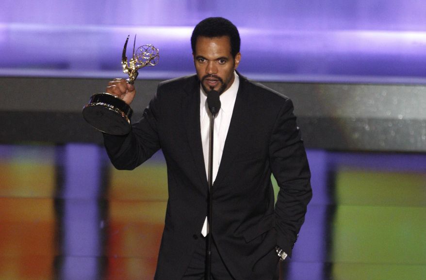 FILE - In this June 20, 2008, file photo Kristoff St. John accepts the award for outstanding supporting actor in a drama series for his work on "The Young and the Restless" at the 35th Annual Daytime Emmy Awards in Los Angeles. Officials say St. John died of heart disease, with heavy drinking at the time of his death as a contributing factor. A coroner’s report released Tuesday lists “hypertrophic heart disease” as the cause of the 52-year-old’s death on Feb. 4 at his home in Los Angeles. “Hypertrophic” means the heart muscle has become abnormally thick. (AP Photo/Matt Sayles, File)