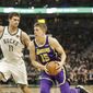 Los Angeles Lakers&#39; Moritz Wagner(15) drives against the Milwaukee Bucks&#39; Brook Lopez during the first half of an NBA basketball game Tuesday, March 19, 2019, in Milwaukee. (AP Photo/Jeffrey Phelps)
