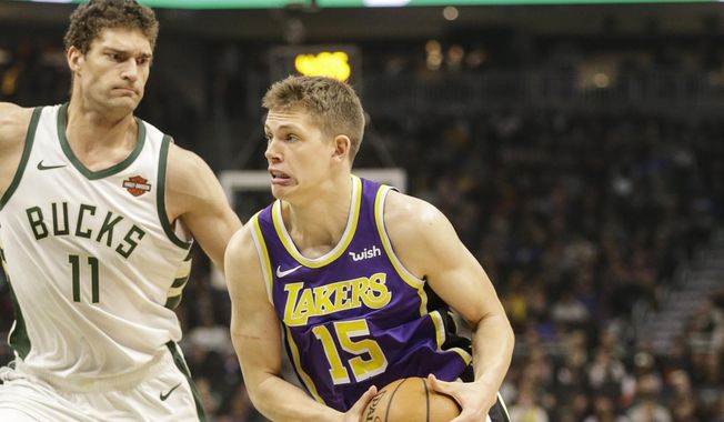 Los Angeles Lakers&#x27; Moritz Wagner(15) drives against the Milwaukee Bucks&#x27; Brook Lopez during the first half of an NBA basketball game Tuesday, March 19, 2019, in Milwaukee. (AP Photo/Jeffrey Phelps)