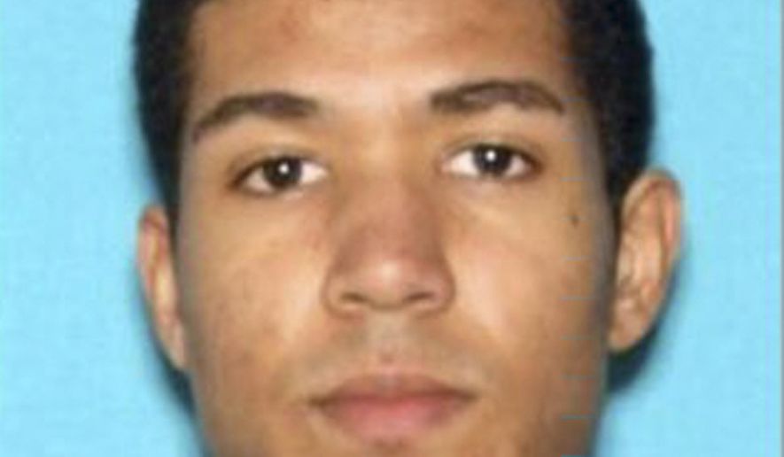 FILE - This undated file booking photo provided by the Los Angeles Police Department show Nicholas K. Oates. Prosecutors on Tuesday, March 19, 2019 charged Oates they say caused a panic at a Los Angeles mall last week. The Los Angeles County District Attorney's Office says Nicholas Oates faces charges including burglary, arson and assault with a firearm. The panic occurred Friday, March 15, when a man entered a store at Westfield Century City mall, took books from shelves and began to ignite them. Police say an employee attempted to stop the man but he pulled a handgun. (Los Angeles Police Department via AP, File)