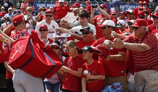 St. Louis Cardinals&#39; Paul Goldschmidt (46) signs autographs for fans before an exhibition spring training baseball game against the Miami Marlins on Wednesday, March 13, 2019, in Jupiter, Fla. (AP Photo/Brynn Anderson)