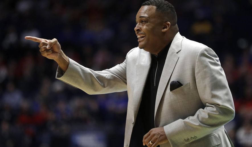 FILE- In this March 16, 2018, file photo Georgia State head coach Ron Hunter calls out form the bench during their first-round game against Cincinnati in the NCAA college basketball tournament in Nashville, Tenn. Hunter’s eager for more NCAA Tournament glory. He has built a once-dismal Georgia State program into a mid-major with a knack for bracket-busting. Before the memorable upset of Baylor, Hunter’s 2001 team was a No. 11 seed which upset No. 6 Wisconsin in the first round. (AP Photo/Mark Humphrey, File)