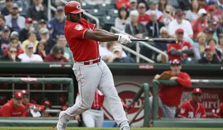 FILE - In this March 11, 2019, file photo, Cincinnati Reds&#39; Yasiel Puig connects for a home run during the third inning of a spring training baseball game Monday,, in Goodyear, Ariz. Puig leads an infusion of players who hope to lead the last-place Reds back to respectability. (AP Photo/Ross D. Franklin, File)