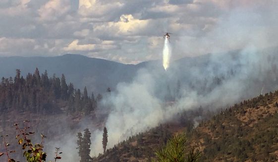 Though the residents of Idaho have long been wary, if not disdainful, of climate change science, the prolonged wildfire smoke has prompted Republicans in the Legislature to reconsider the issue. (Associated Press)