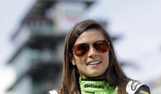 FILE - In this May 20, 2018, file photo, Danica Patrick waits during qualifications for the IndyCar Indianapolis 500 auto race at Indianapolis Motor Speedway in Indianapolis. Patrick, who retired from racing after last year&#39;s Indianapolis 500, will join NBC Sports&#39; inaugural coverage of the Indianapolis 500 as a studio analyst alongside host Mike Tirico. (AP Photo/Darron Cummings, File)
