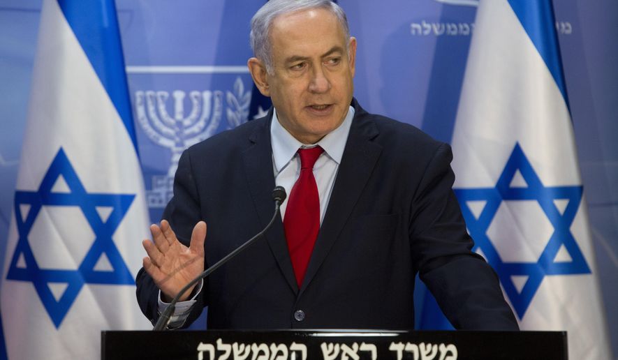 Israeli Prime Minister Benjamin Netanyahu gestures as he speaks during joint statements with U.S. Secretary of State Mike Pompeo at the Prime Minister's office in Jerusalem, Wednesday, March 20, 2019. Pompeo has given Israel's leader a welcome boost at the height of a tight re-election campaign. (AP Photo/Sebastian Scheiner, Pool)
