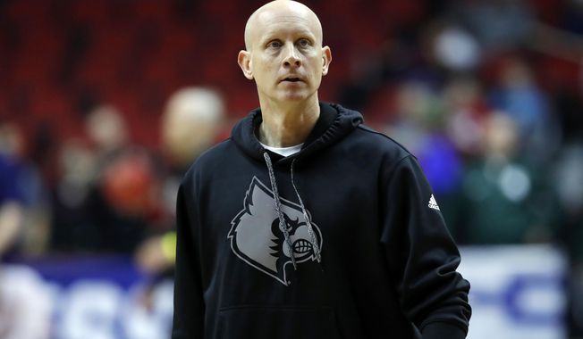 Louisville head coach Chris Mack watches his team during practice at the NCAA men&#x27;s college basketball tournament, Wednesday, March 20, 2019, in Des Moines, Iowa. Louisville plays Minnesota on Thursday. (AP Photo/Charlie Neibergall)