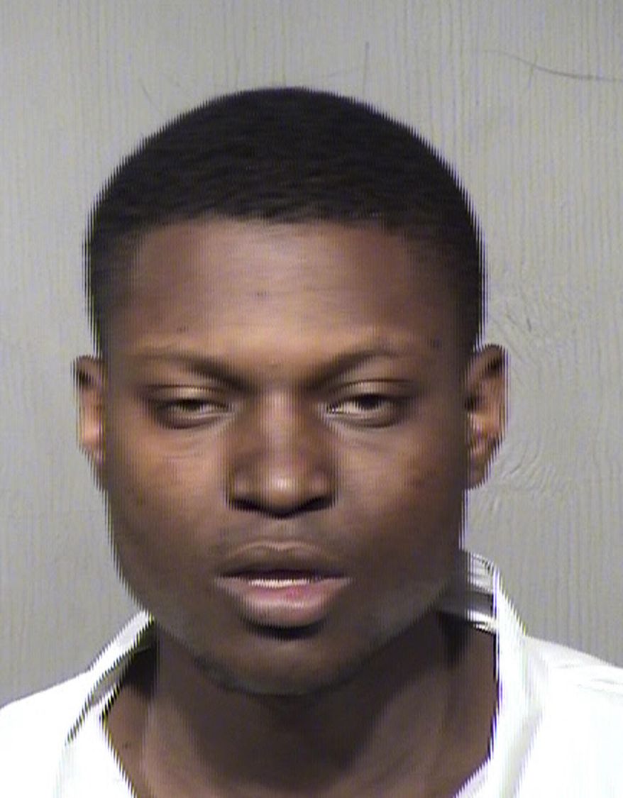 This Tuesday, March 19, 2019, photo provided by the Maricopa County Sheriff's Office shows Jeffrey Craig Rhone II. Phoenix police say Rhone, arrested in a shooting in which two people were killed and four others were wounded, reportedly was angry about his wallet being stolen while he was at the home where the shooting occurred. Police say Rhone II argued with several people at the home Monday, March 18, 2019, about his stolen wallet, left but then returned, and got into a fight with one person before being "physically removed" from the home. Police later spotted Rhone driving and arrested him without incident on Tuesday. (Maricopa County Sheriff's Office via AP)
