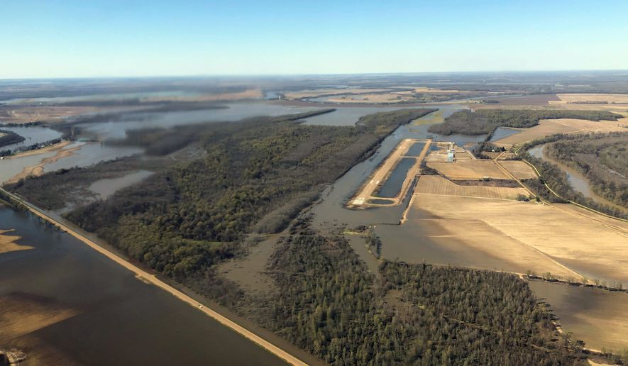 Backwater flooding begins to encircle the Yazoo City, Miss., airport., Sunday, March 17, 2019, as seen in this aerial photograph. Various communities in the Mississippi Delta are combatting both Mississippi River flooding and backwater flooding that are affecting homes, businesses and farm lands. (AP Photo/Holbrook Mohr)