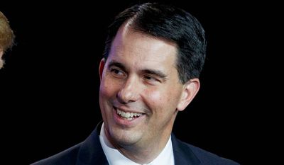 Wisconsin Gov. Scott Walker attends an event to make remarks at a Foxconn facility in Mt. Pleasant, Wis. (AP Photo/Evan Vucci, File)