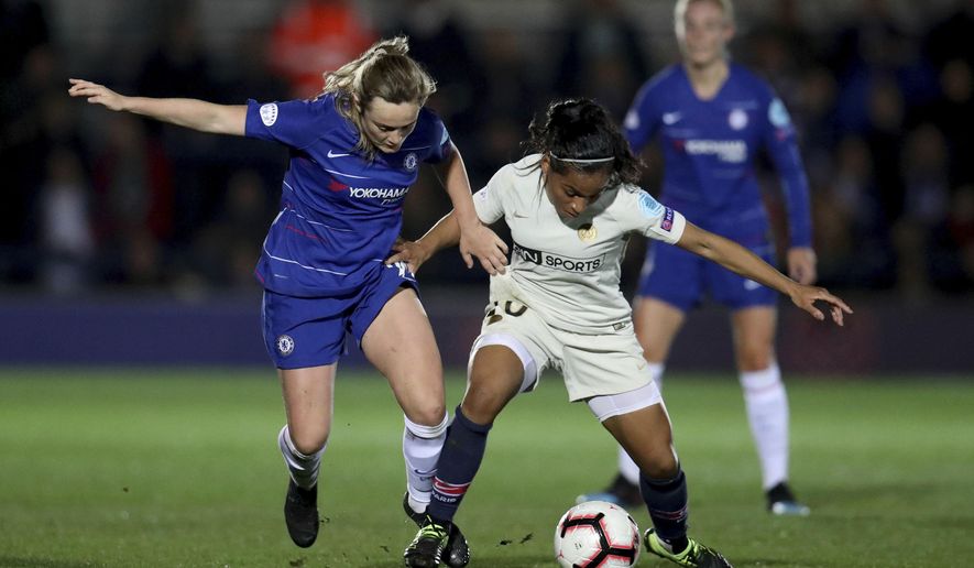 Chelsea Women's Erin Cuthbert, left, in action with Paris Saint-Germain Women's Perle Morroni during their Women's Champions League quarter final first leg match at the Cherry Red Records Stadium in London, Thursday March 21, 2019. (Bradley Collyer/PA via AP)