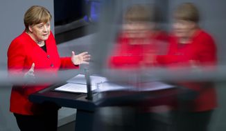 German Chancellor Angela Merkel delivers a speech about the Brexit ahead of a meeting of the European council, at the German parliament Bundestag in Berlin, Germany, Thursday, March 21, 2019. (AP Photo/Markus Schreiber)