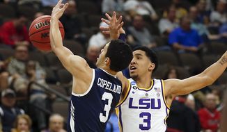 Yale &#x27;s Alex Copeland, left, and LSU&#x27;s Tremont Waters go after a loose ball during the first half of a first round men&#x27;s college basketball game in the NCAA Tournament, in Jacksonville, Fla. Thursday, March 21, 2019. (AP Photo/Stephen B. Morton)