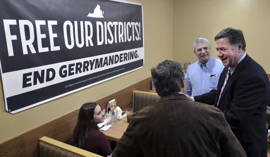 In this Feb. 2, 2019, photo, former Virginia Gov. and U.S. Sen. George Allen (right) talks with supporters during a stop in Bristol, Va. Allen was on a five-city town hall tour of Virginia to discuss the need for nonpartisan and transparent redistricting reform during this year's General Assembly session. In Vermont, a commission submits plans for state House and Senate districts to the state Legislature, which can approve or change them. (David Crigger/Bristol Herald Courier via AP) **FILE**