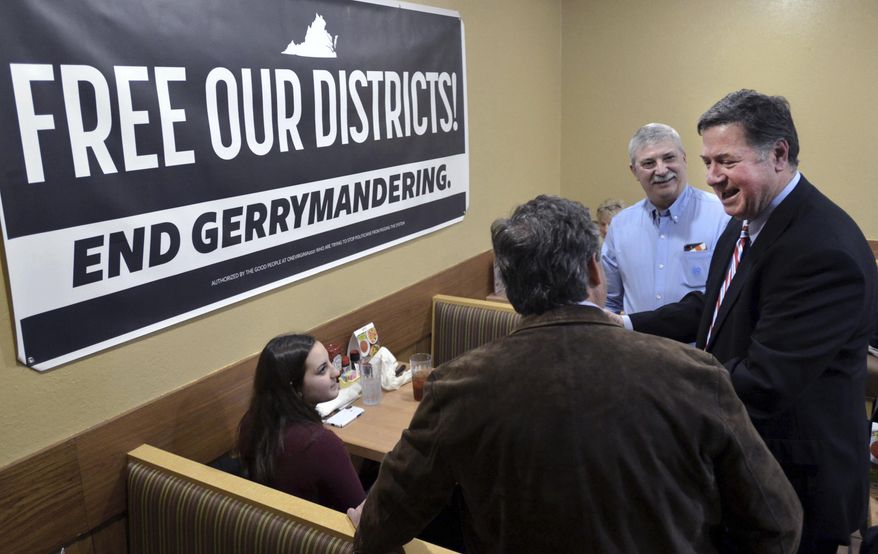 In this Feb. 2, 2019, photo, former Virginia Gov. and U.S. Sen. George Allen (right) talks with supporters during a stop in Bristol, Va. Allen was on a five-city town hall tour of Virginia to discuss the need for nonpartisan and transparent redistricting reform during this year's General Assembly session. In Vermont, a commission submits plans for state House and Senate districts to the state Legislature, which can approve or change them. (David Crigger/Bristol Herald Courier via AP) **FILE**