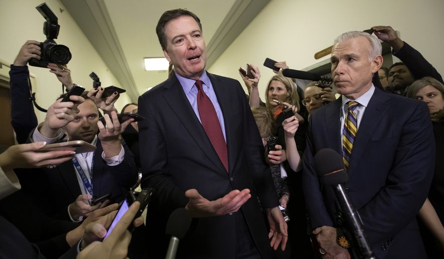 In this Dec. 7, 2018, file photo, former FBI Director James Comey, with his attorney, David Kelley, right, speaks to reporters after a day of testimony before the House Judiciary and Oversight committees, on Capitol Hill in Washington. (AP Photo/J. Scott Applewhite, File) **FILE**