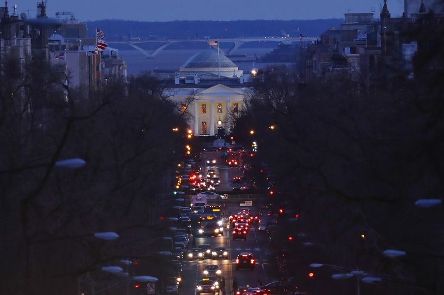 The American flag flies over the White House as vehicles move along 16th Street, in northwest Washington, Friday, March 22, 2019. (AP Photo/Pablo Martinez Monsivais) ** FILE **