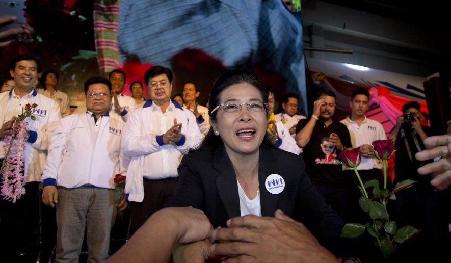 The leader of Pheu Thai Party and candidate for prime minister Sudarat Keyuraphan reaches to shake hands of supporters during an election rally concluding their campaign ahead of general election in Bangkok, Thailand, Friday, March 22, 2019. The nation&#x27;s first general election since the military seized power in a 2014 coup is scheduled to be held on March 24. (AP Photo/Gemunu Amarasinghe)