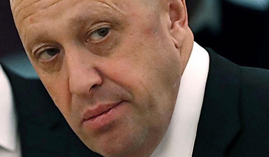 FILE - In this July 4, 2017 file photo, Russian businessman Yevgeny Prigozhin is shown prior to a meeting of Russian President Vladimir Putin and Chinese President Xi Jinping in the Kremlin in Moscow, Russia. (Sergei Ilnitsky/Pool Photo via AP, File)