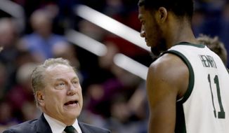 Michigan State coach Tom Izzo talks to Aaron Henry (11) during the second half of a second round men&#39;s college basketball game against Minnesota in the NCAA Tournament, in Des Moines, Iowa, Saturday, March 23, 2019. (AP Photo/Nati Harnik)