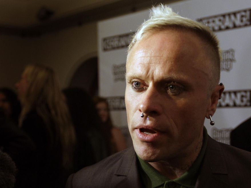 FILE - In this file photo dated Monday, Aug. 3, 2009, British musician Keith Flint of Prodigy talks to the media after winning the best single for 'Omen' at the Kerrang Awards 2009, at the Brewery in London. The surviving members of the band Prodigy have invited fans of the late Keith Flint to line a procession route ahead of a private service celebrating his life on March 29. The band tweeted Saturday, March 23, 2019, that a church service for Flint will be for family and close friends only but that speakers would be provided so fans outside can hear. (AP Photo/Joel Ryan, FILE)