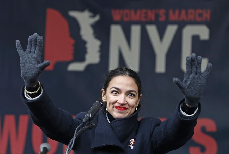 In this Jan. 19, 2019, file photo, U.S. Rep. Alexandria Ocasio-Cortez, (D-New York) waves to the crowd after speaking at Women's Unity Rally in Lower Manhattan in New York. (AP Photo/Kathy Willens, File)