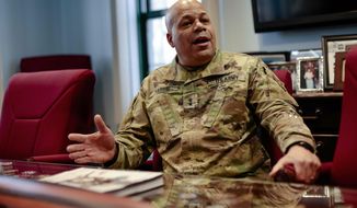 In this Wednesday, March 6, 2019 photo, Maj. Gen. John C. Harris Jr., Ohio&#39;s new adjutant general, answers a question during an interview in his office at the Ohio National Guard Headquarters in Columbus, Ohio. “The physical demands of land combat are rigorous,” he said. “Retraining our forces to fight in an austere environment — living from your tank, from your rucksack — and readying our combat commanders is so important.” (Joshua A. Bickel/The Columbus Dispatch via AP)