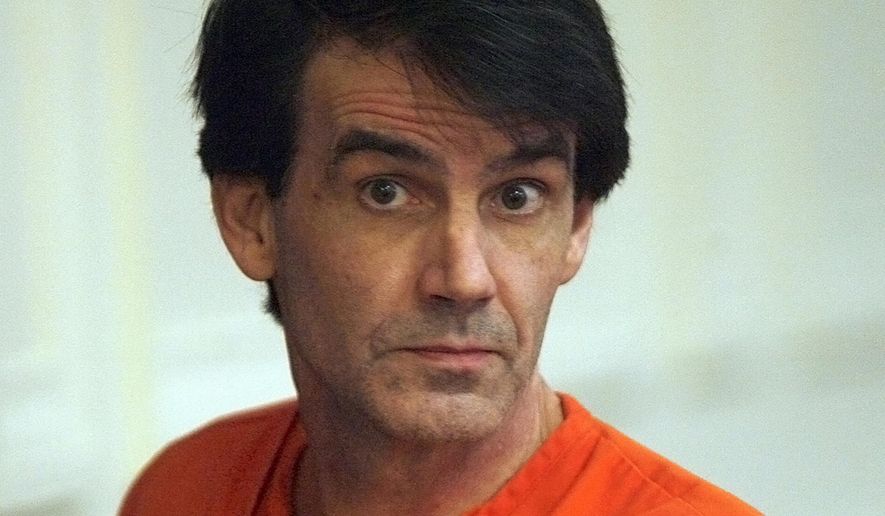 FILE--In this Oct. 2011, file photo, James Kraig Kahler listens to the judge while being sentenced in Osage County Court in Lyndon, Kansas. The U.S. Supreme Court has agreed to consider a Kansas death penalty case that could have implications for mentally ill defendants across the nation. The case involves Kahler, convicted and sentenced to death for the 2009 fatal shootings of his estranged wife, her grandmother and his two teenage daughters. His attorneys argue that he was suffering from depression so severe that he experienced extreme emotional disturbance, dissociating him from reality. (Anthony S. Bush/The Topeka Capital Journal via AP, Pool, File)