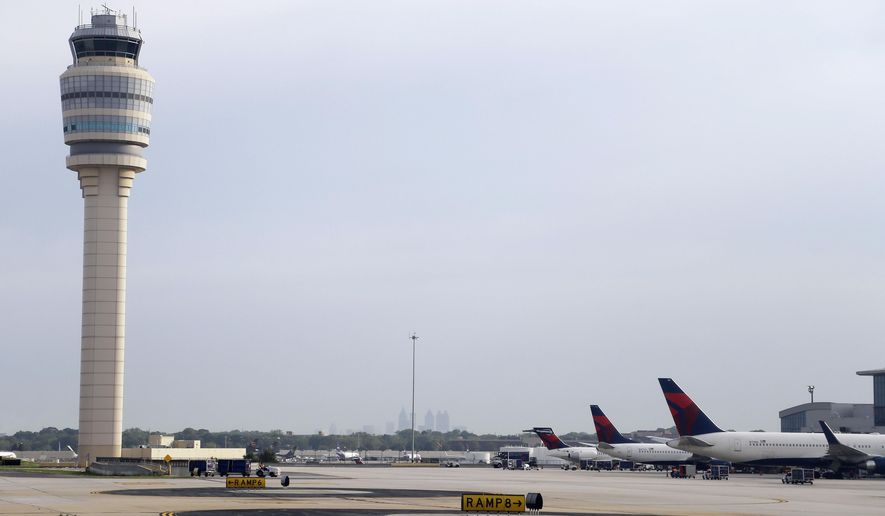 In this Monday, May 9, 2016 photo, aircraft sit at their gates at Hartsfield–Jackson Atlanta International Airport, in Atlanta. Georgia lawmakers are working quickly to push through high-profile bills about medical marijuana, Medicaid and the Atlanta airport. (AP Photo/Mike Stewart)