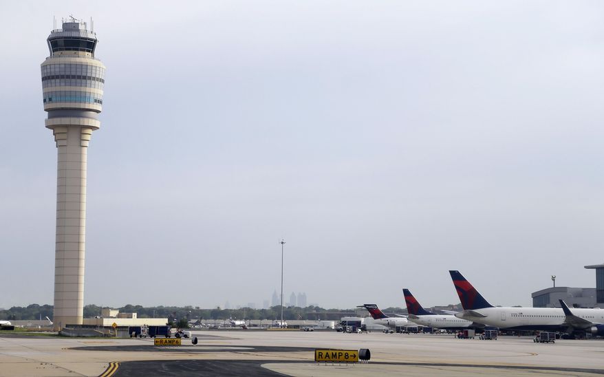 In this Monday, May 9, 2016 photo, aircraft sit at their gates at Hartsfield–Jackson Atlanta International Airport, in Atlanta. Georgia lawmakers are working quickly to push through high-profile bills about medical marijuana, Medicaid and the Atlanta airport. (AP Photo/Mike Stewart)