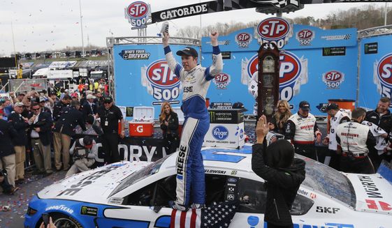 Brad Keselowski celebrates in Victory Lane after winning the NASCAR Cup Series auto race at Martinsville Speedway in Martinsville, Va., Sunday, March 24, 2019. (AP Photo/Steve Helber)