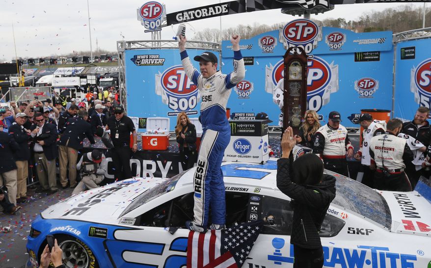 Brad Keselowski celebrates in Victory Lane after winning the NASCAR Cup Series auto race at Martinsville Speedway in Martinsville, Va., Sunday, March 24, 2019. (AP Photo/Steve Helber)