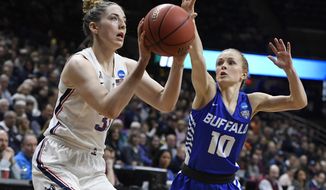 Connecticut&#x27;s Katie Lou Samuelson (33) looks to shoot as Buffalo&#x27;s Hanna Hall (10) defends during the first half of a second-round women&#x27;s college basketball game in the NCAA tournament, Sunday, March 24, 2019, in Storrs, Conn. (AP Photo/Jessica Hill)
