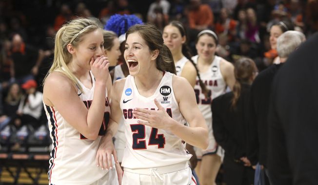 Gonzaga&#x27;s Katie Campbell (24) and Chandler Smith (30) celebrate their win over Little Rock following a first-round game of the NCAA women&#x27;s college basketball tournament in Corvallis, Ore., Saturday, March 23, 2019. (AP Photo/Amanda Loman)