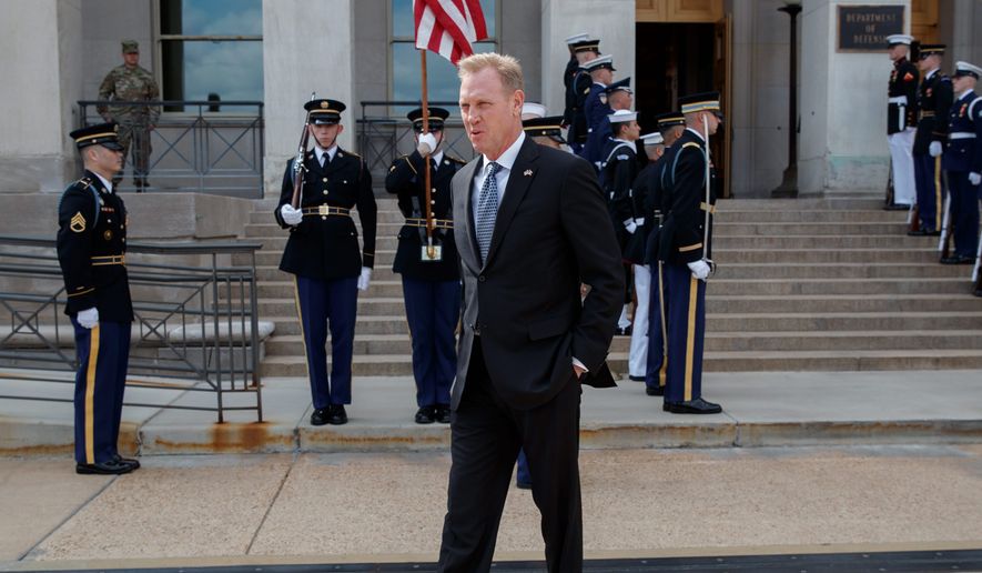Acting Defense Secretary Patrick Shanahan walks to talk to the media before the arrival of French Defense Minister Florence Parly at the Pentagon, Monday, March 18, 2019. (AP Photo/Carolyn Kaster)