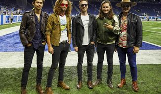 FILE - This Sept. 10, 2018 file photo shows members of the band LANCO on the field before a NFL football game between the Detroit Lions and the New York Jets in Detroit. The Academy of Country Music named LANCO as best new group of the year.  The group of five released their first album “Hallelujah Nights” last year on Arista Nashville. (AP Photo/Rick Osentoski, File)